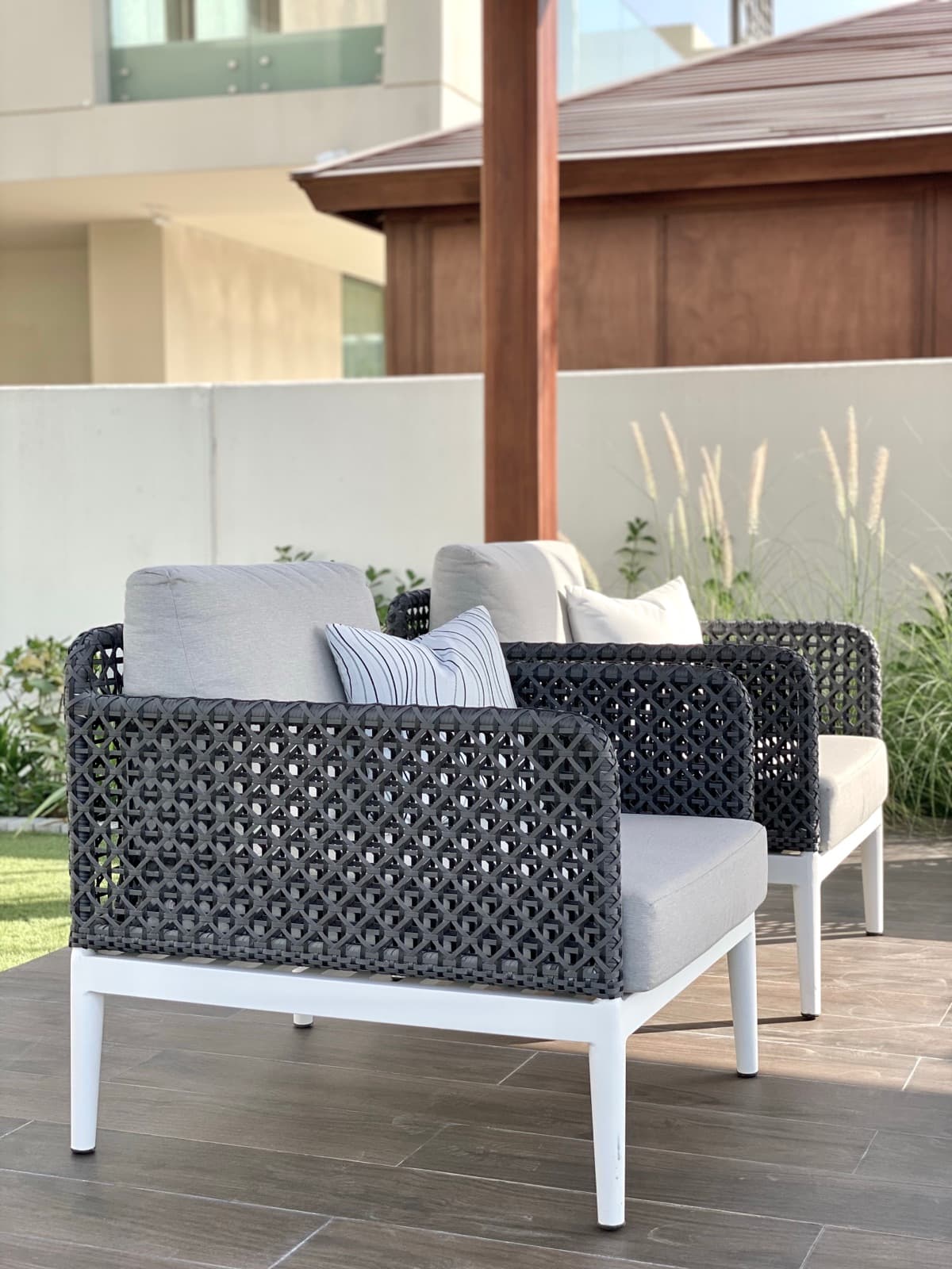 BLOOM PURE lounge chairs under a pergola at a Dubai Hills villa