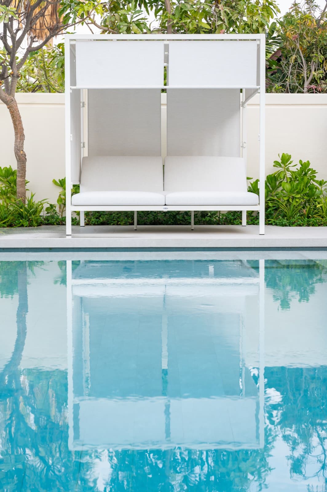 BLOOM CABANA daybed across the pool of a Victory Heights villa, Dubai